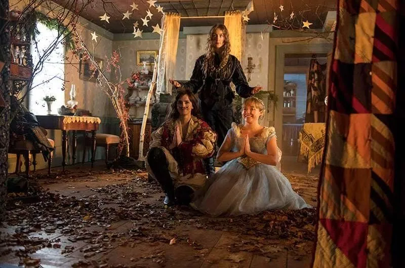 Film set from Little Women showing the sisters in a decorated attic room