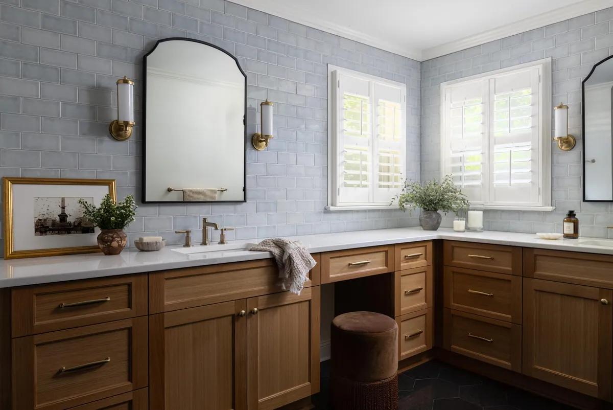 spa like primary bathroom with white oak cabinetry and gray blue tile