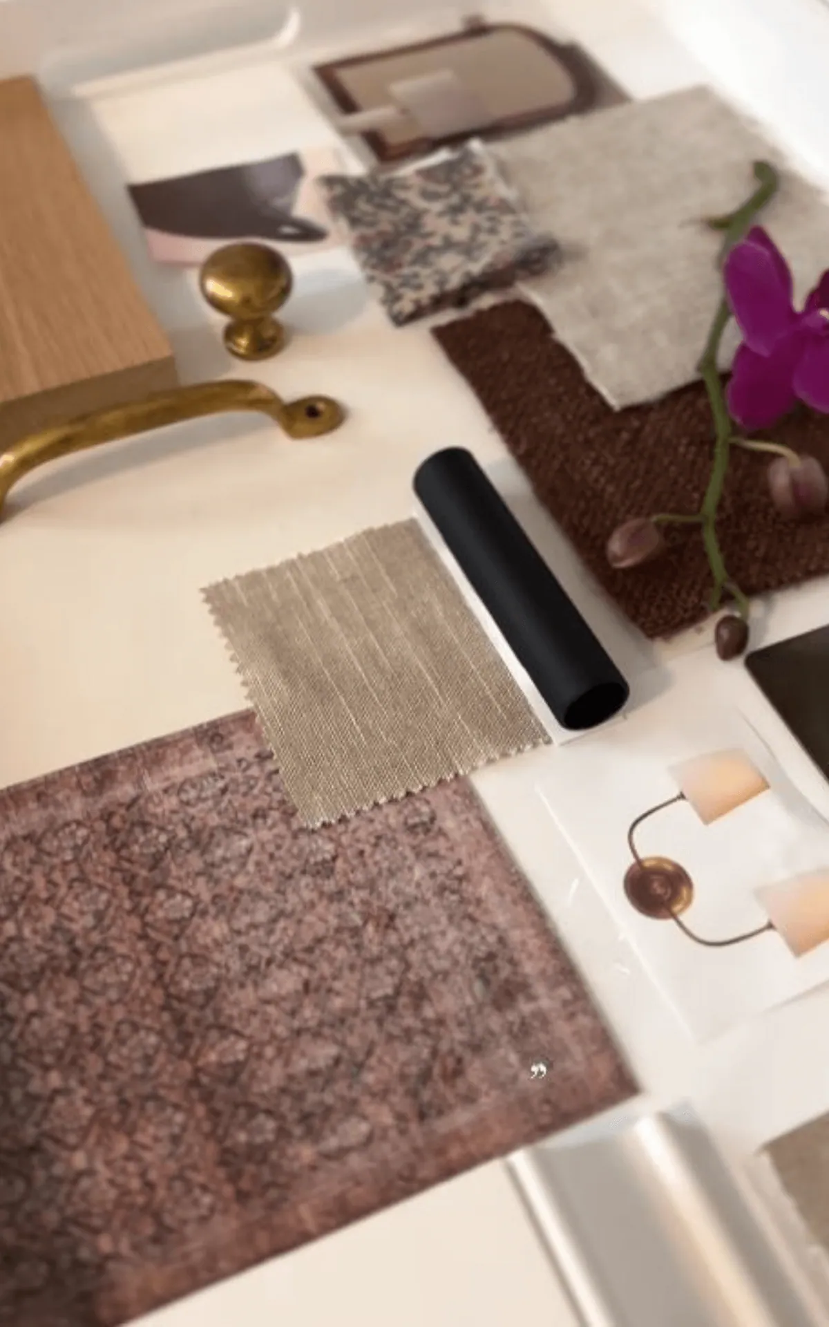 Fabric, rug and hardware samples laid out during a House of Maevie selections meeting