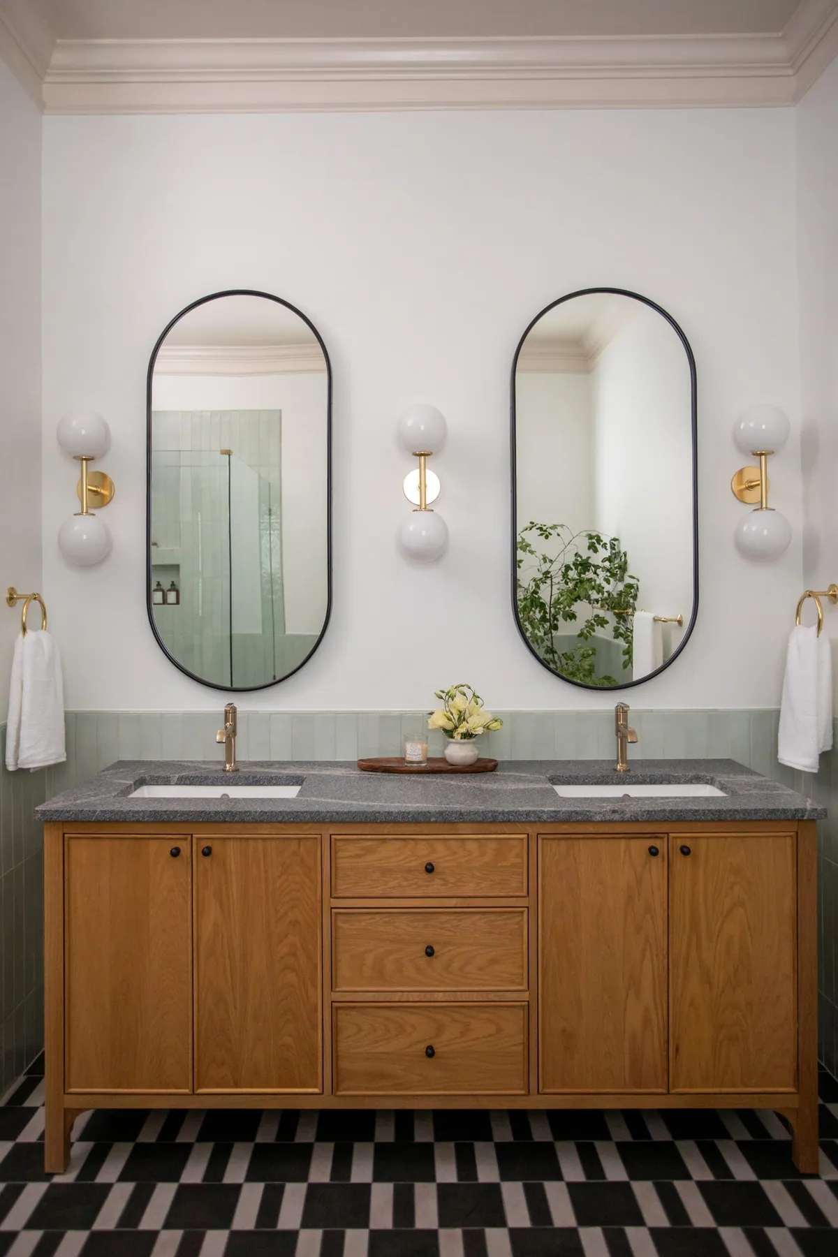 Modern double vanity with brass globe sconces