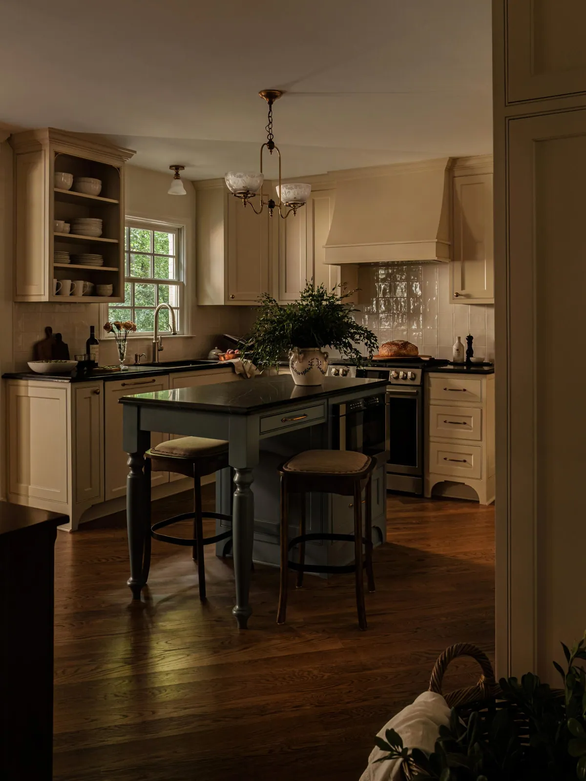 Traditional kitchen renovation with cream inset cabinetry, a gray-blue island and soapstone counters